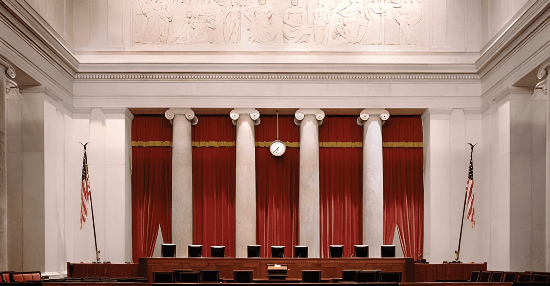 Empty ornate courtroom with red curtains